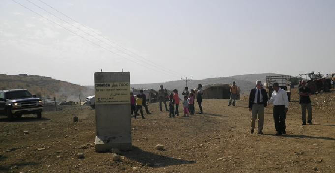 Ein Il Hilwe and the Israeli block "Danger - Firing area - Entrance forbidden" - In back ground Maskyyot colony