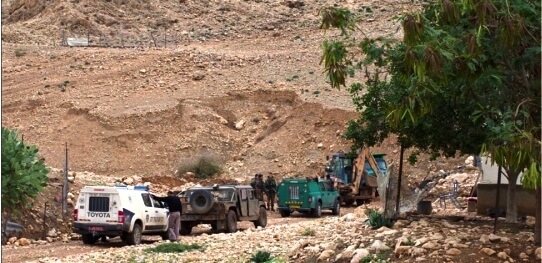 Three cars: the police, army and Nature and Parks Authority coming to confiscate Khiar’s tractor