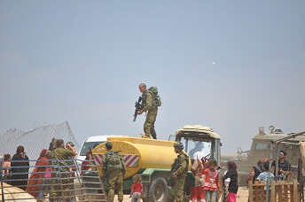 IOF confiscate portable water tank June 2012