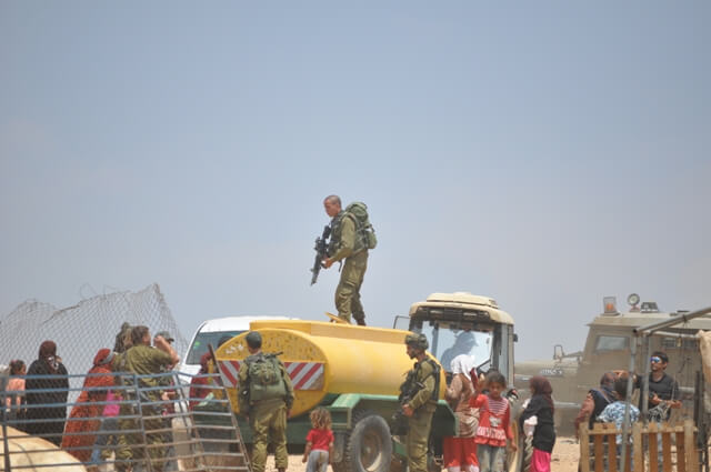 Israeli occupation forces confiscate a portable water tank in Al Maleh 21 June 2012 3
